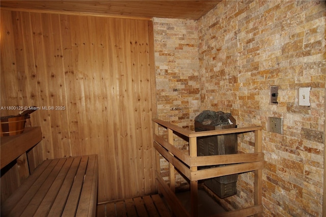 sauna featuring wood ceiling