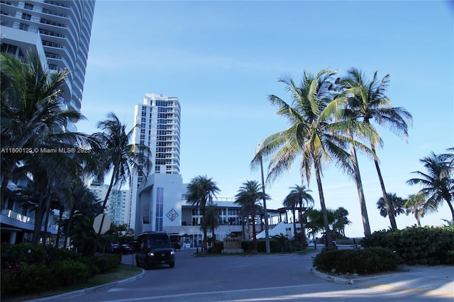 view of building exterior featuring uncovered parking