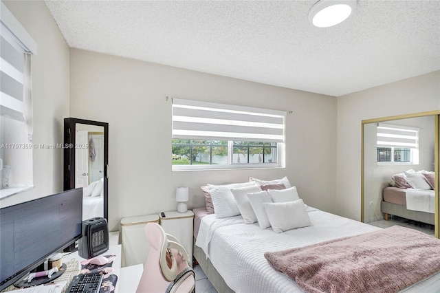 707 W 39th Pl, Hialeah, FL 33012 - bedroom with a textured ceiling