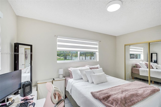 707 W 39th Pl, Hialeah, FL 33012 - bedroom with a closet and a textured ceiling