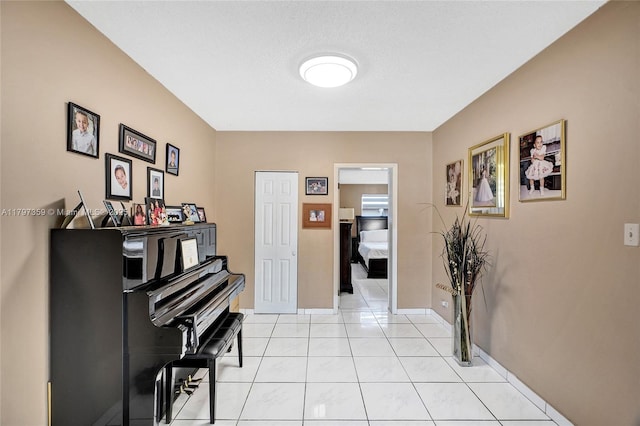 707 W 39th Pl, Hialeah, FL 33012 - corridor with light tile patterned flooring and baseboards