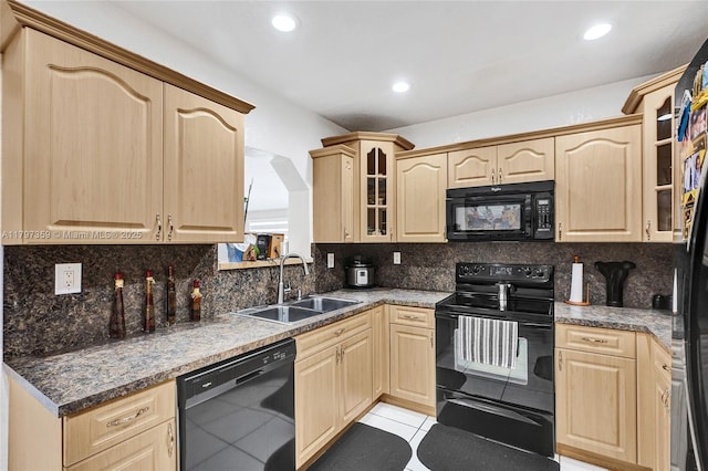 707 W 39th Pl, Hialeah, FL 33012 - kitchen featuring black appliances, light brown cabinets, glass insert cabinets, and recessed lighting