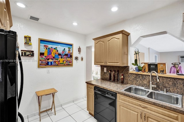 707 W 39th Pl, Hialeah, FL 33012 - kitchen featuring black appliances, dark countertops, light brown cabinetry, decorative backsplash, and light tile patterned floors