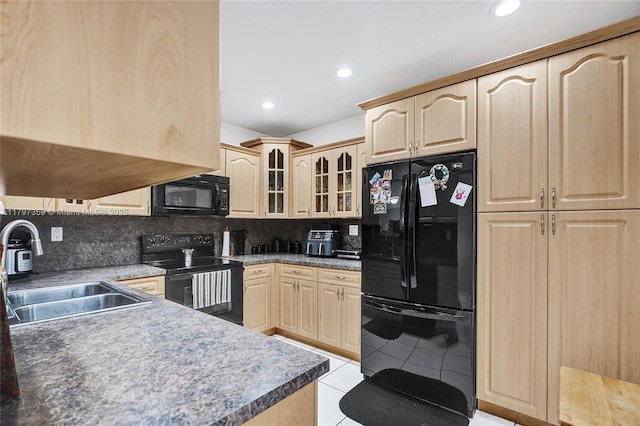 707 W 39th Pl, Hialeah, FL 33012 - kitchen with black appliances, light brown cabinetry, glass insert cabinets, tasteful backsplash, and recessed lighting