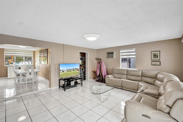 707 W 39th Pl, Hialeah, FL 33012 - living room with light tile patterned flooring, a textured ceiling, and an AC wall unit