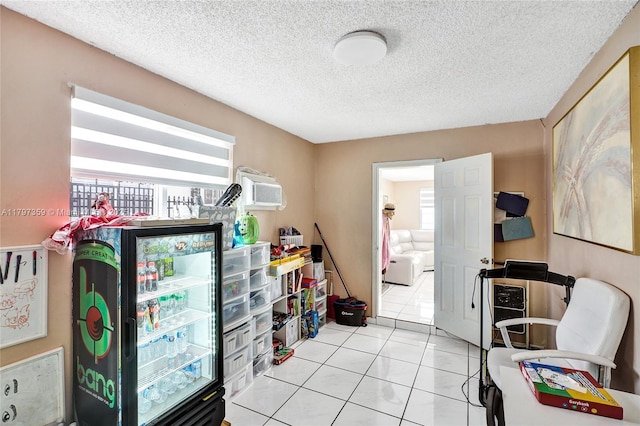 707 W 39th Pl, Hialeah, FL 33012 - office area featuring a wall mounted air conditioner, a textured ceiling, and light tile patterned flooring
