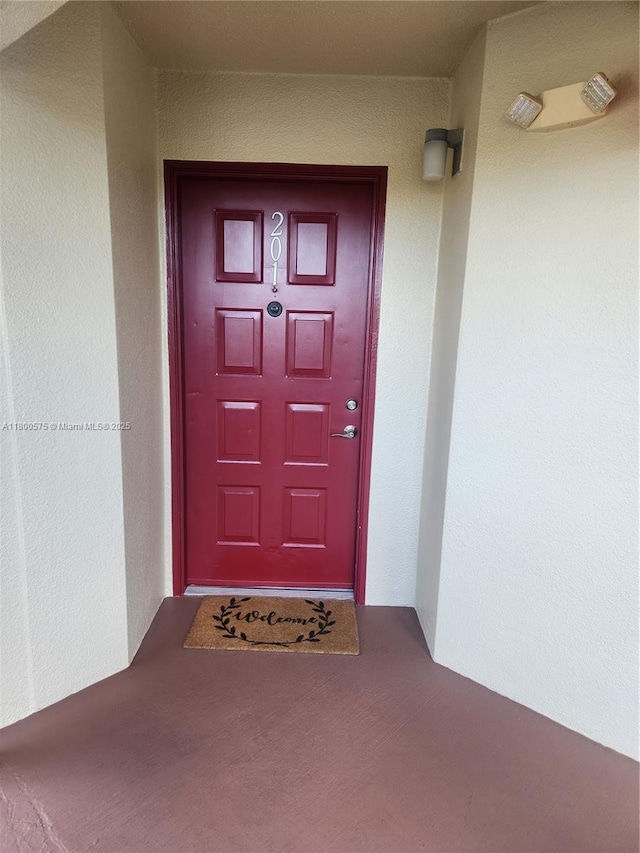 1601 SW 128th Ter Unit 201A, Pembroke Pines, FL 33027 - view of exterior entry featuring stucco siding