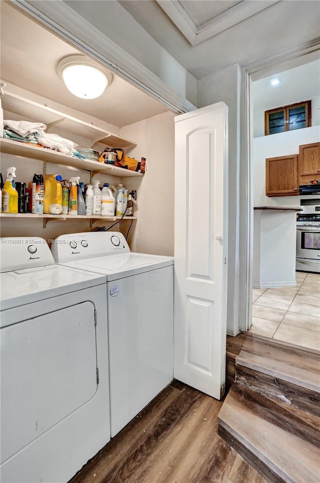 326 S 14th, Hollywood, FL 33020 - washroom featuring washer and clothes dryer and light wood-style flooring