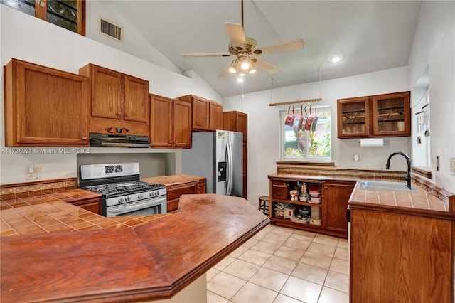 326 S 14th, Hollywood, FL 33020 - kitchen with appliances with stainless steel finishes, a sink, tile counters, under cabinet range hood, and ceiling fan