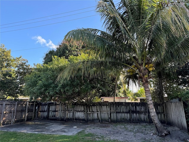 fenced backyard featuring a patio area