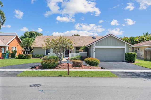 8400 NW 52nd St, Lauderhill, FL 33351 - single story home with asphalt driveway and an attached garage