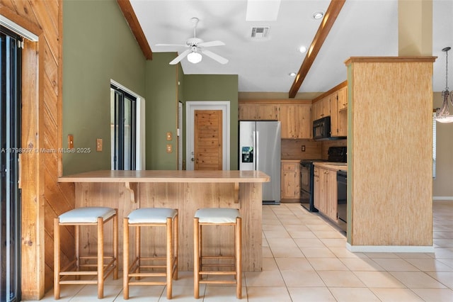 8400 NW 52nd St, Lauderhill, FL 33351 - kitchen with black appliances, a peninsula, light countertops, a ceiling fan, and a kitchen bar