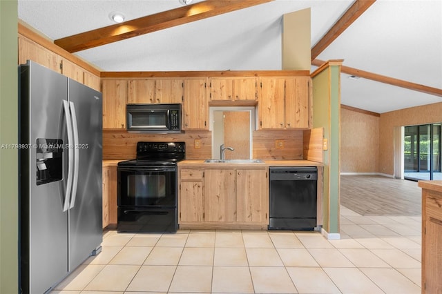 8400 NW 52nd St, Lauderhill, FL 33351 - kitchen featuring black appliances, light countertops, a sink, light tile patterned floors, and baseboards