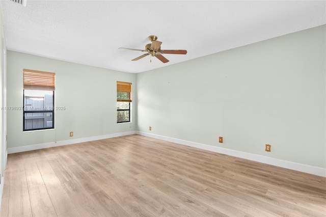 8400 NW 52nd St, Lauderhill, FL 33351 - empty room with ceiling fan, light wood-style floors, and baseboards
