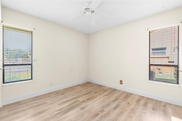 8400 NW 52nd St, Lauderhill, FL 33351 - spare room featuring light wood finished floors, a ceiling fan, and baseboards