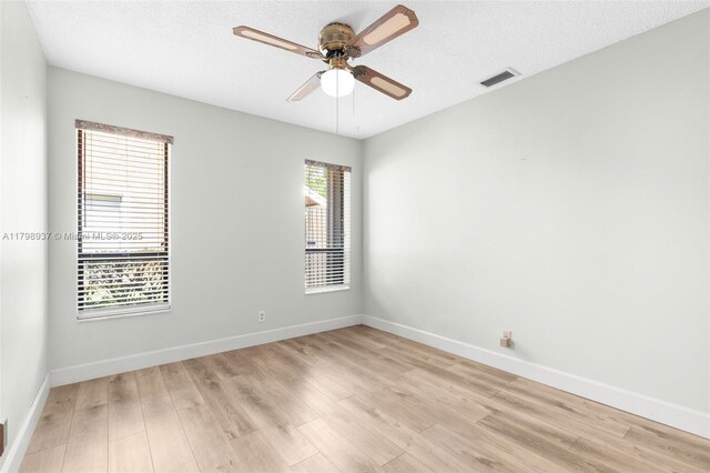 8400 NW 52nd St, Lauderhill, FL 33351 - empty room featuring a ceiling fan, light wood finished floors, baseboards, and a textured ceiling