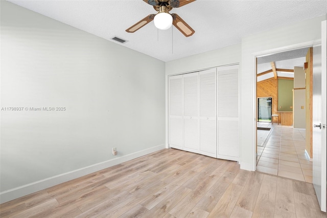 8400 NW 52nd St, Lauderhill, FL 33351 - unfurnished bedroom featuring light wood-type flooring, a closet, baseboards, and a ceiling fan