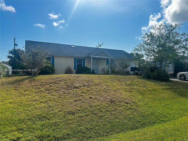 ranch-style house with a front lawn