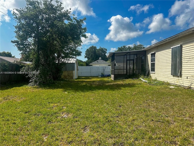 view of yard with a sunroom