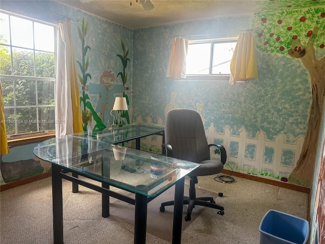 home office with plenty of natural light, carpet flooring, wallpapered walls, and baseboards
