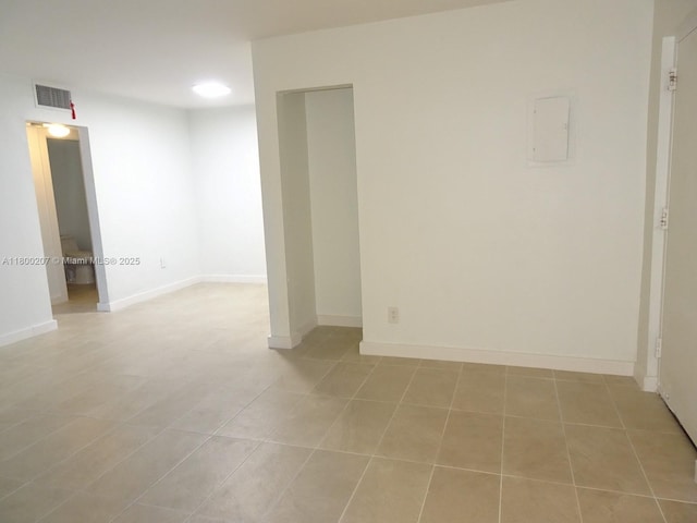 13500 NE 3rd Ct Unit 217, North Miami, FL 33161 - unfurnished room featuring light tile patterned floors, baseboards, and electric panel