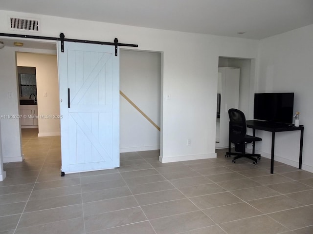 13500 NE 3rd Ct Unit 217, North Miami, FL 33161 - office area with tile patterned floors and a barn door