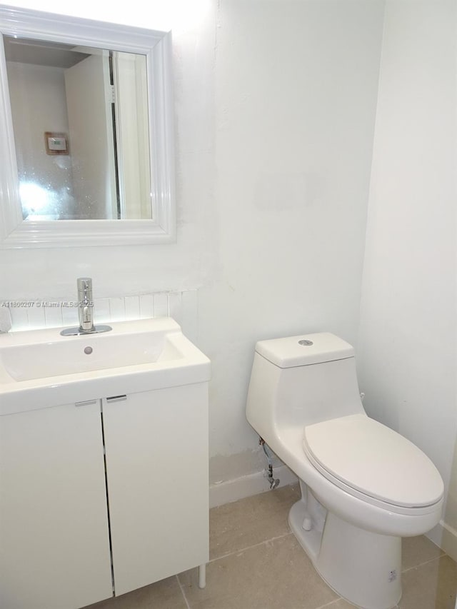 13500 NE 3rd Ct Unit 217, North Miami, FL 33161 - half bathroom featuring vanity, toilet, and tile patterned floors