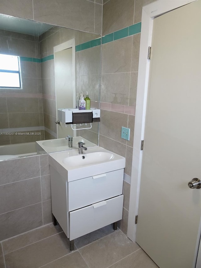 13500 NE 3rd Ct Unit 217, North Miami, FL 33161 - full bath with tile walls, vanity, tile patterned flooring, and tiled tub