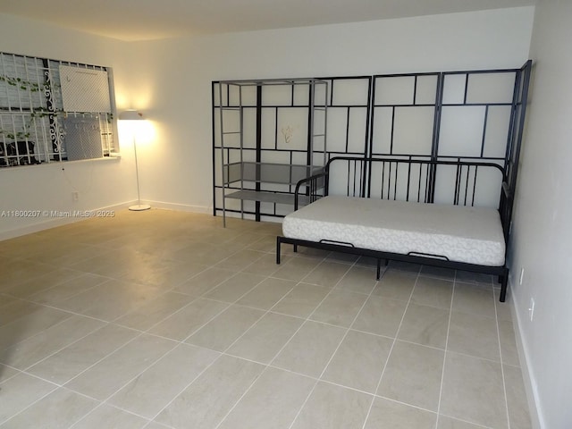 13500 NE 3rd Ct Unit 217, North Miami, FL 33161 - tiled bedroom with baseboards