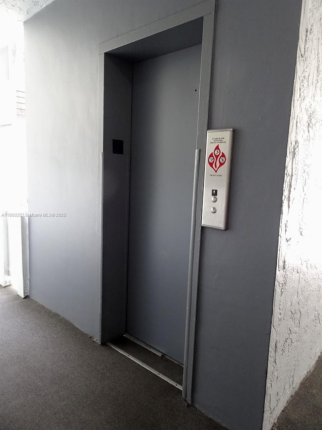 13500 NE 3rd Ct Unit 217, North Miami, FL 33161 - hall featuring carpet flooring and elevator