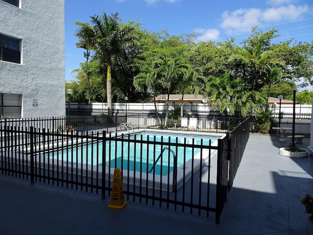 13500 NE 3rd Ct Unit 217, North Miami, FL 33161 - view of swimming pool with a patio area
