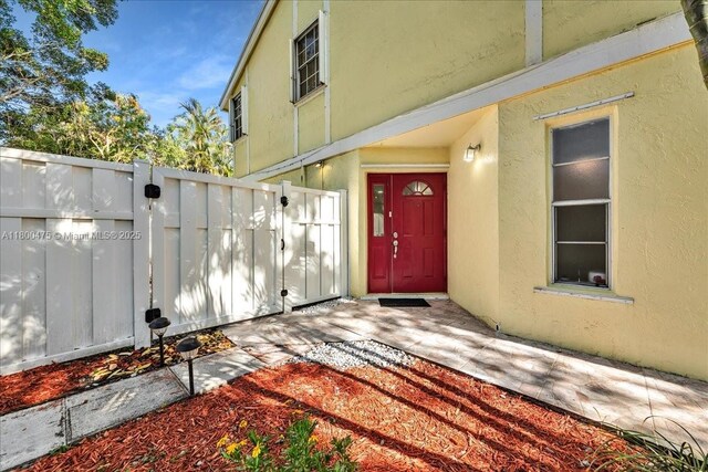 1060 SW 111th Way, Davie, FL 33324 - entrance to property with stucco siding and fence