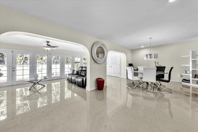 1060 SW 111th Way, Davie, FL 33324 - living area with french doors, arched walkways, baseboards, tile patterned flooring, and recessed lighting