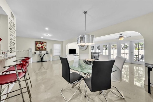 1060 SW 111th Way, Davie, FL 33324 - dining space with arched walkways, plenty of natural light, a ceiling fan, light tile patterned floors, and recessed lighting