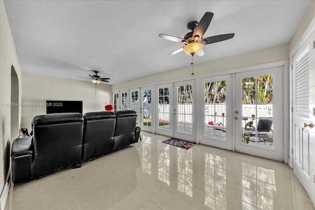 1060 SW 111th Way, Davie, FL 33324 - home theater featuring french doors, a ceiling fan, and light tile patterned flooring