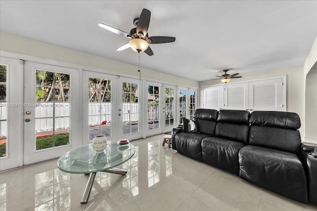1060 SW 111th Way, Davie, FL 33324 - living room with french doors, ceiling fan, healthy amount of natural light, and light tile patterned floors