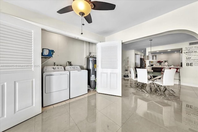 1060 SW 111th Way, Davie, FL 33324 - laundry area featuring electric water heater, washing machine and dryer, ceiling fan, tile patterned flooring, and arched walkways