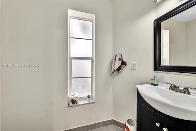 1060 SW 111th Way, Davie, FL 33324 - bathroom featuring healthy amount of natural light, vanity, and baseboards