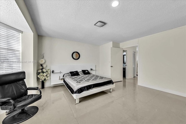1060 SW 111th Way, Davie, FL 33324 - tiled bedroom featuring a textured ceiling and baseboards