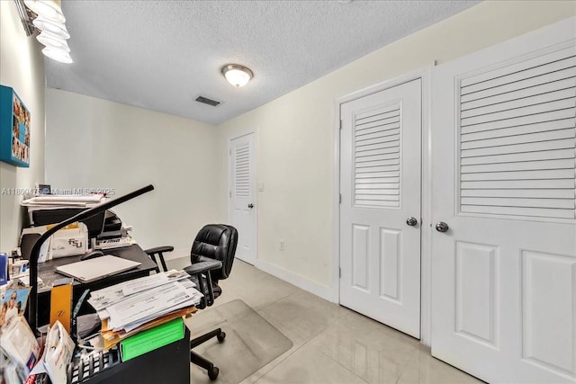1060 SW 111th Way, Davie, FL 33324 - home office with a textured ceiling and light tile patterned floors