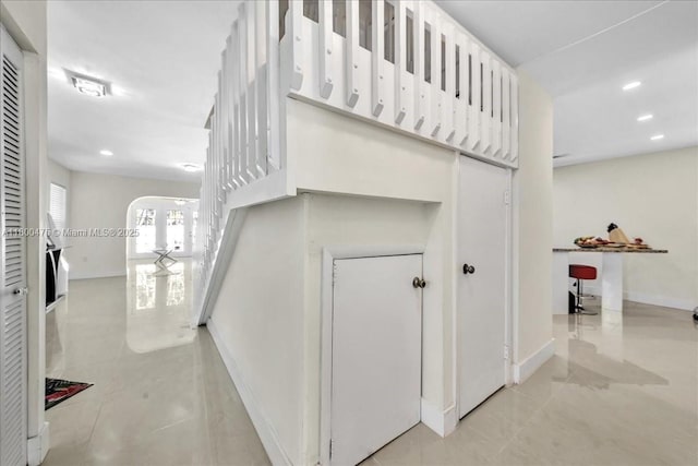 1060 SW 111th Way, Davie, FL 33324 - stairway with baseboards, tile patterned flooring, arched walkways, and recessed lighting