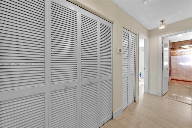 1060 SW 111th Way, Davie, FL 33324 - corridor featuring a textured ceiling and baseboards