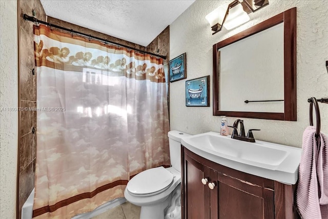 1060 SW 111th Way, Davie, FL 33324 - bathroom featuring a textured wall, a textured ceiling, toilet, vanity, and tile patterned flooring