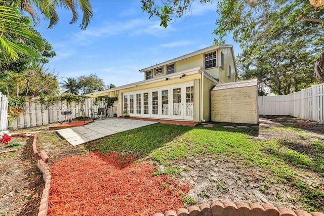 1060 SW 111th Way, Davie, FL 33324 - rear view of house featuring a patio, a fenced backyard, french doors, and stucco siding
