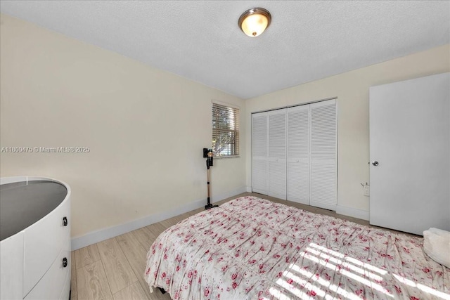 1060 SW 111th Way, Davie, FL 33324 - bedroom with a closet, baseboards, and a textured ceiling