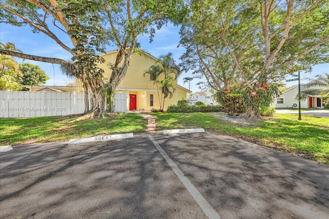 1060 SW 111th Way, Davie, FL 33324 - view of front of house with uncovered parking and stucco siding