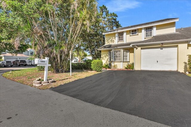 1060 SW 111th Way, Davie, FL 33324 - view of front of home featuring driveway and stucco siding