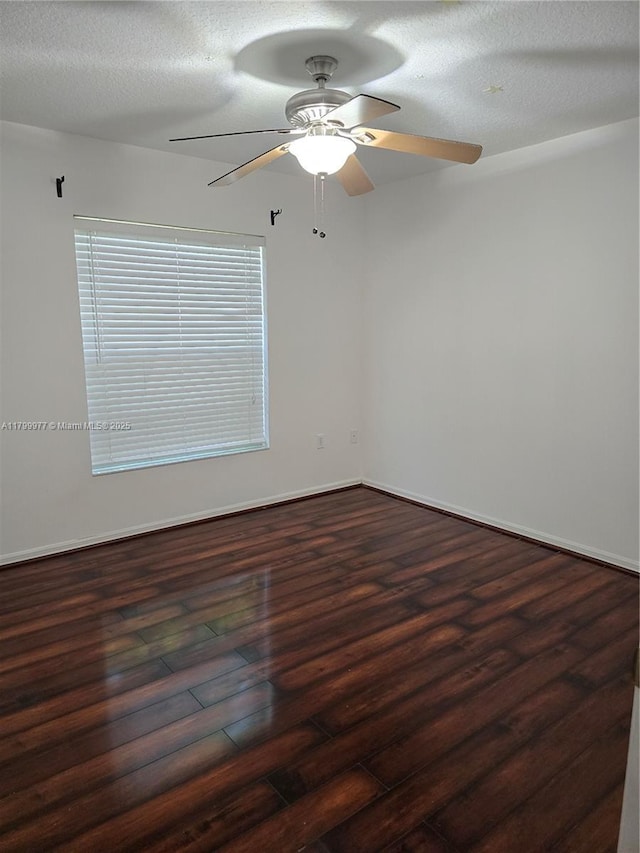 453 Dahoon Holly Dr, Daytona Beach, FL 32117 - spare room featuring a ceiling fan, dark wood-type flooring, and baseboards