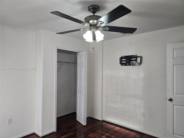 453 Dahoon Holly Dr, Daytona Beach, FL 32117 - unfurnished bedroom with dark wood-style floors, a closet, ceiling fan, and baseboards