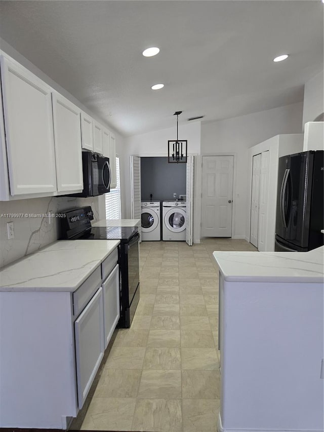 453 Dahoon Holly Dr, Daytona Beach, FL 32117 - kitchen with black appliances, washing machine and dryer, white cabinetry, recessed lighting, and light stone countertops